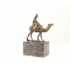 Bronze sculpture of a camel with it's rider