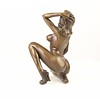 Bronze sculpture of a kneeling female nude pleasing herself