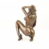 Bronze sculpture of a kneeling female nude pleasing herself