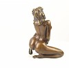 Bronze sculpture of a kneeling female nude pleasing herself