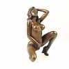 Bronze sculpture of a kneeling female nude pleasing herself