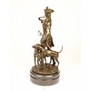 Een bronzen beeldengroep met Louis XV met honden