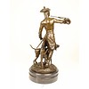A bronze sculpture of a huntsman with horn and hounds