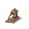 A bronze sculpture of a wild boar