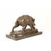 A bronze sculpture of a wild boar