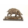 A bronze sculpture of a wild boar
