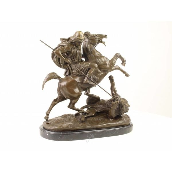  A bronze sculpture of an Arab horseman killing a lion