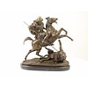 A bronze sculpture of an Arab horseman killing a lion