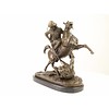 A bronze sculpture of an Arab horseman killing a lion