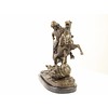 A bronze sculpture of an Arab horseman killing a lion