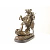 A bronze sculpture of an Arab horseman killing a lion