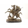 A bronze sculpture of an Arab horseman killing a lion