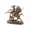 A bronze sculpture of an Arab horseman killing a lion