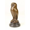 A bronze sculpture of a young owl