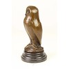 A bronze sculpture of a young owl