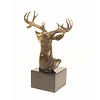 A bronze sculpture of a stag head