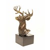 A bronze sculpture of a stag head