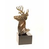 A bronze sculpture of a stag head