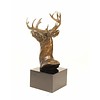 A bronze sculpture of a stag head