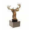 A bronze sculpture of a stag head