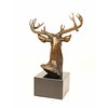 A bronze sculpture of a stag head