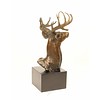 A bronze sculpture of a stag head
