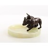 Een onyx asbak met twee bronzen bulldog pups