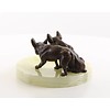 An onyx ashtray mounted with two pugs