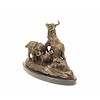 A bronze sculpture of a goat family