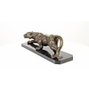A bronze sculpture of a prowling panther