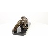 A bronze sculpture of a prowling panther