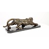 A bronze sculpture of a prowling panther