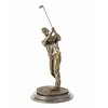 A bronze sculpture of a golfer in follow through stance