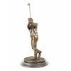 A bronze sculpture of a golfer in follow through stance