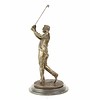 A bronze sculpture of a golfer in follow through stance