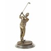 A bronze sculpture of a golfer in follow through stance