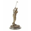 A bronze sculpture of a golfer in follow through stance