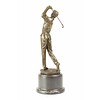 A bronze sculpture of a golfer in action