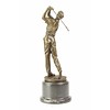 A bronze sculpture of a golfer in action
