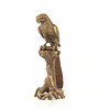 A bronze sculpture of a Macaw parrot perched on a branch