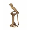 A bronze sculpture of a Macaw parrot perched on a branch