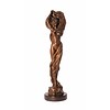 A  bronze sculpture of a partly nude female with swirling cloth