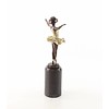 A bronze sculpture of a young ballerina