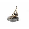 An erotic bronze sculpture of a naked female pleasing herself