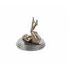 An erotic bronze sculpture of a naked female pleasing herself