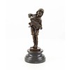 A  bronze sculpture of a boy playing the accordion