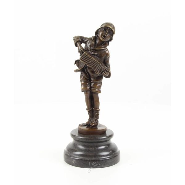  A  bronze sculpture of a boy playing the accordion