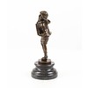 A  bronze sculpture of a boy playing the accordion