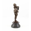 A  bronze sculpture of a boy playing the accordion