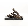 Bronze sculpture of an Art Deco sitting female dancer